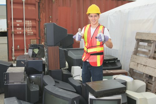 Professionals clearing furniture in a Coney Hall home