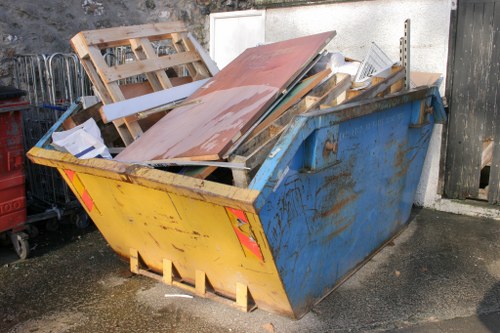 Construction site with waste materials ready for clearance in Coney Hall