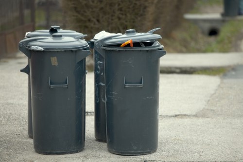 Front-view of a commercial waste collection vehicle operating in a service area